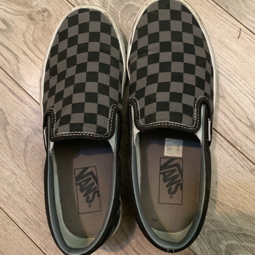 Black/Grey checkered Vans.
